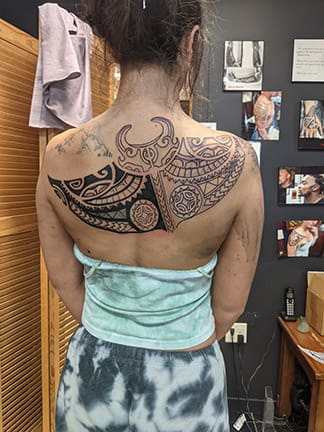 A black-and-white back tattoo