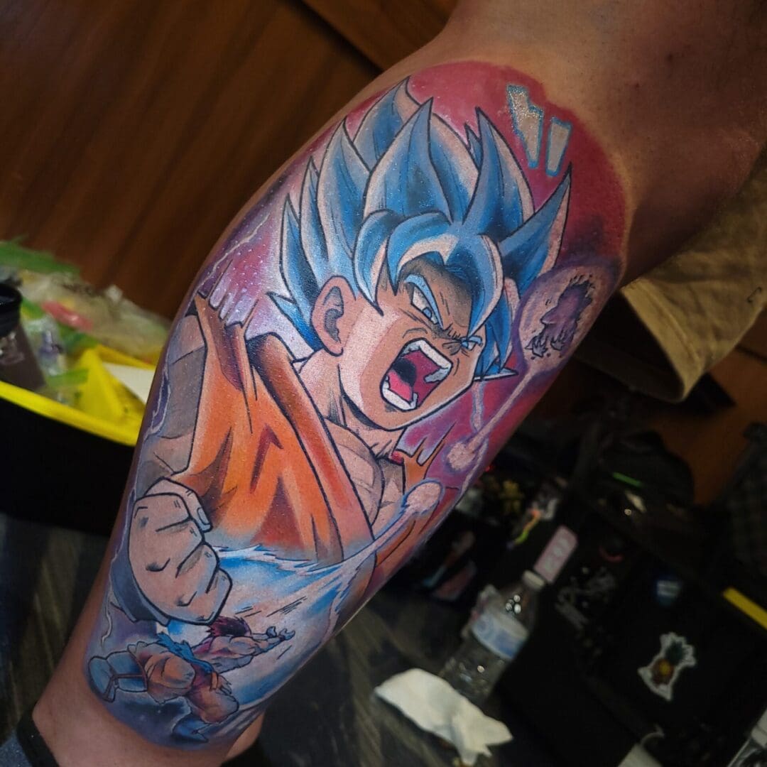 A dragon ball z tattoo is shown on the arm.