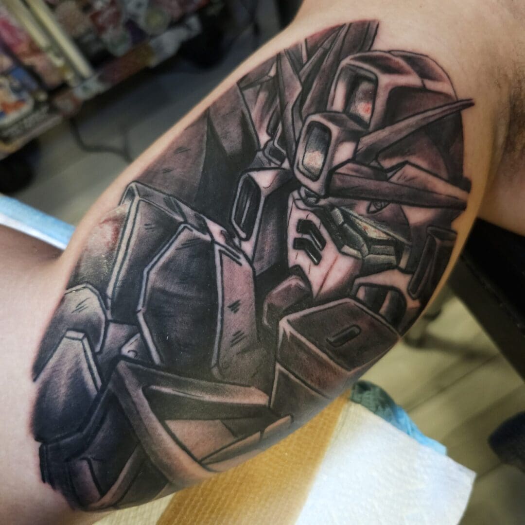 A tattoo of a robot on the arm